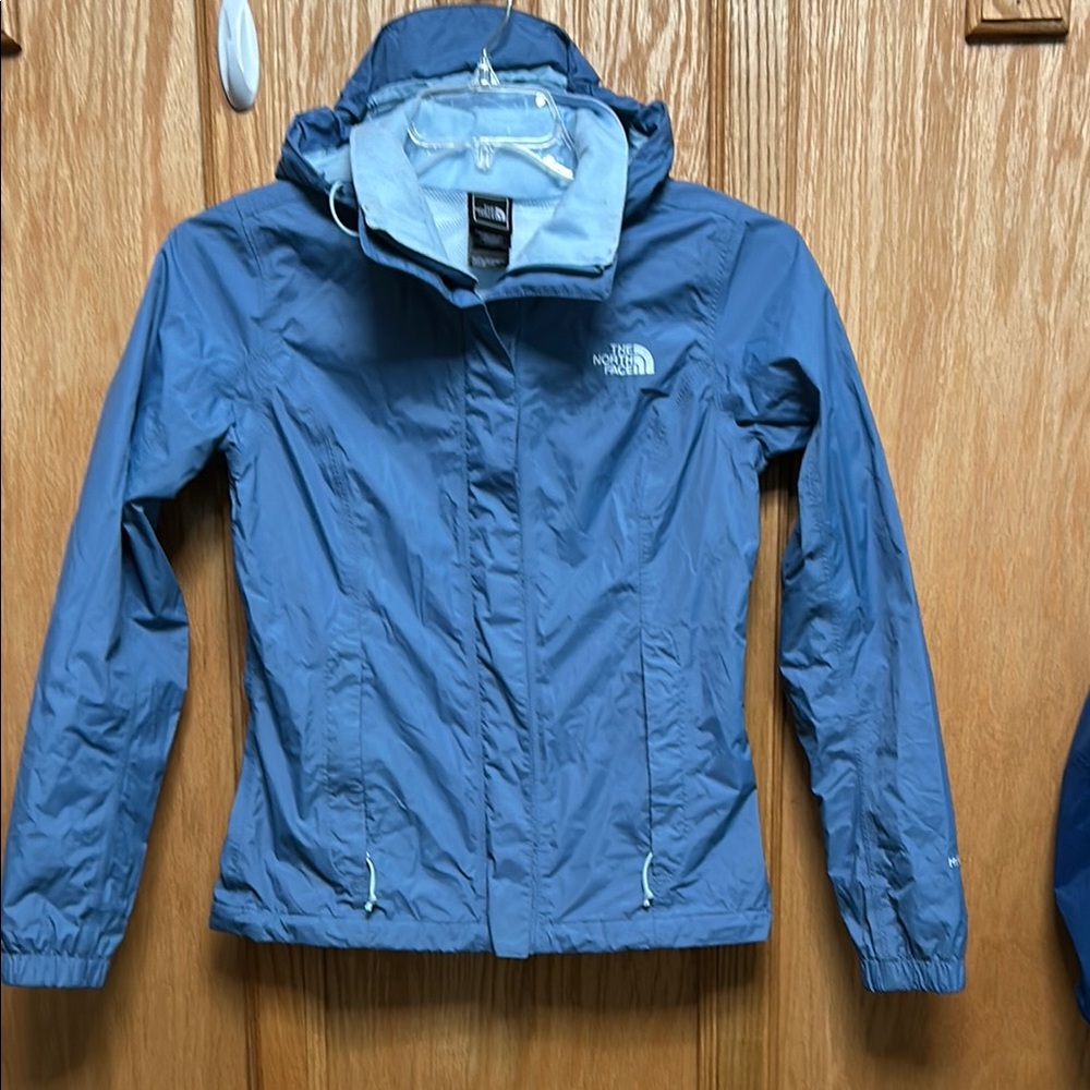 The North Face Women's Blue, hooded rain Jacket.